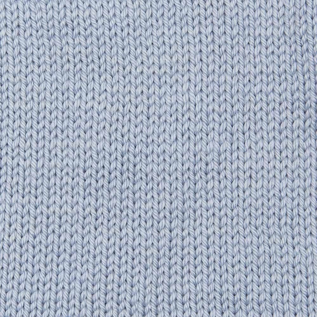 Handknit swatch of light blue Debbie Bliss Cashmerino Aran Yarn.