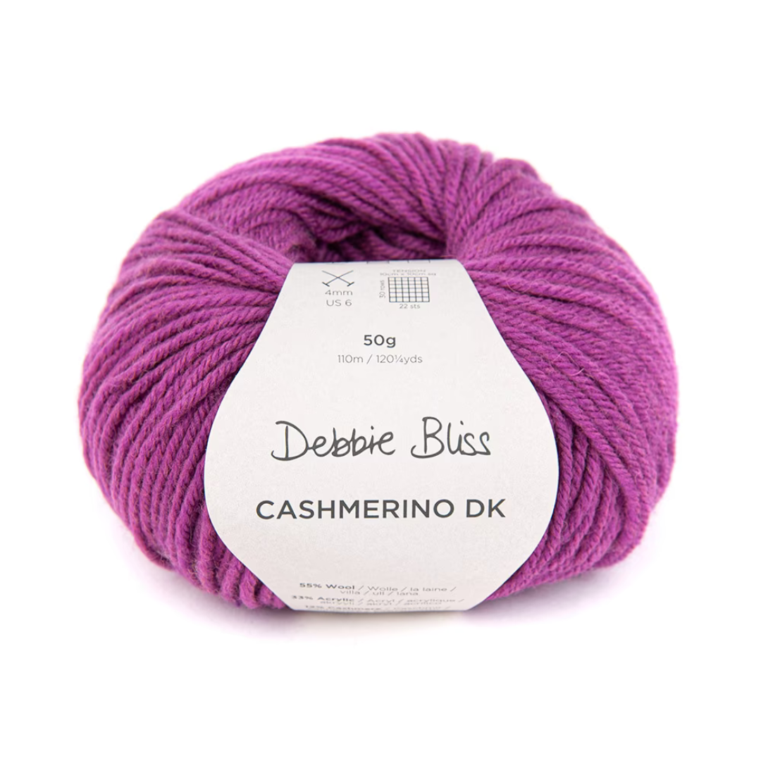Deep purple-pink cake of yarn. A Debbie Bliss Cashmerino DK yarn in shade Fuschia.