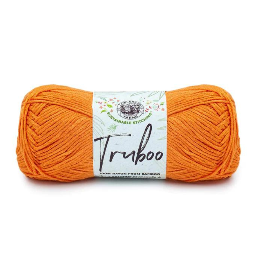Medium orange skein of Lion Brand Truboo yarn on a white background. Shade name is Tangerine.