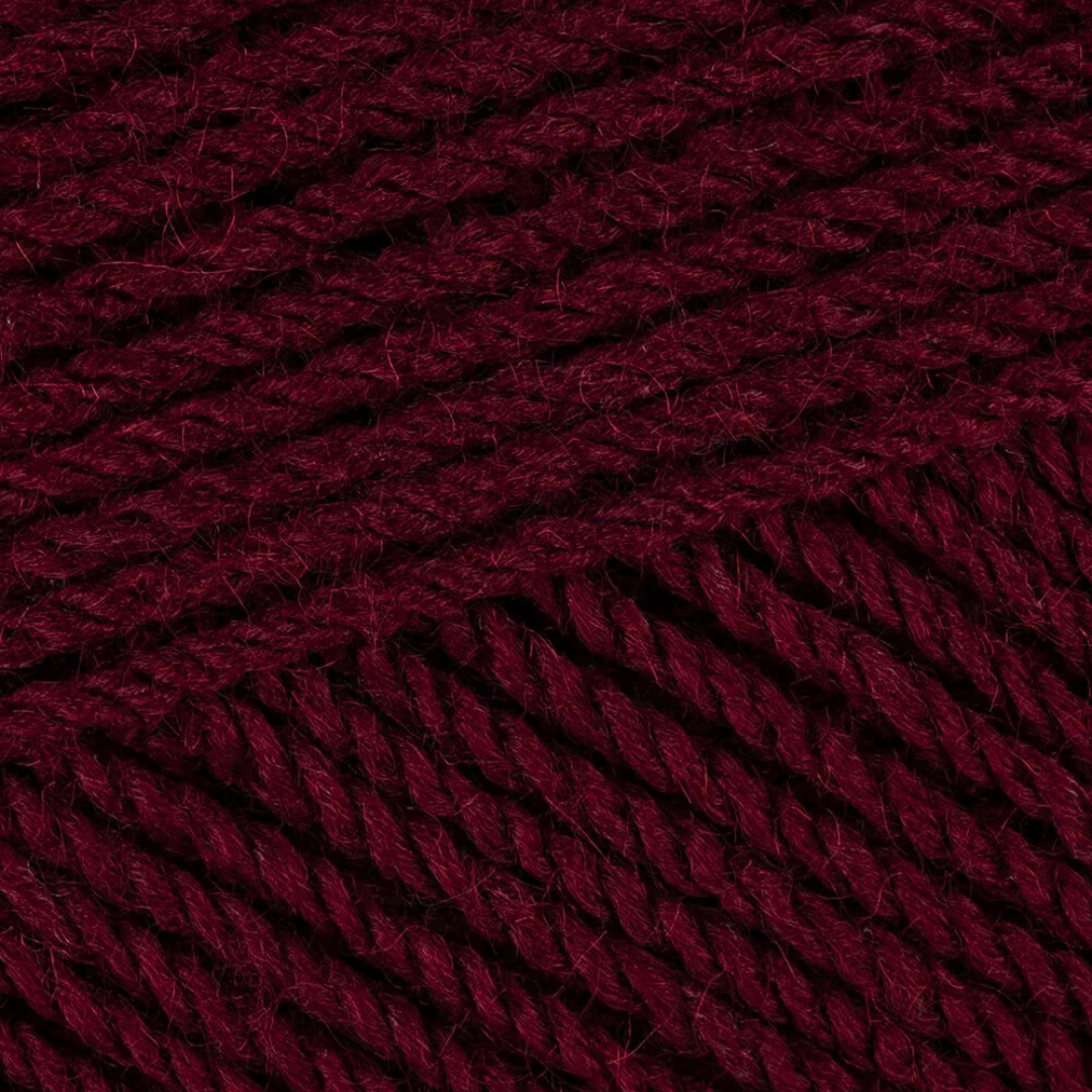 Close-up picture of Stylecraft Special DK yarn in shade Burgundy. It is a deep reddish brown color.