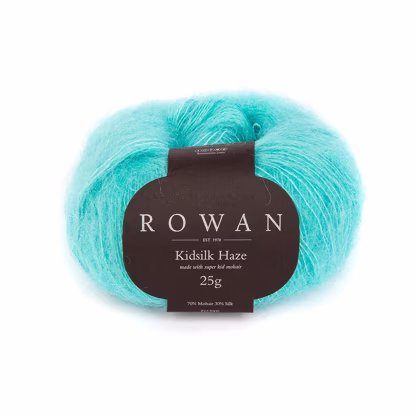A cake of Rown Kidsilk Haze yarn that looks fuzzy and soft.