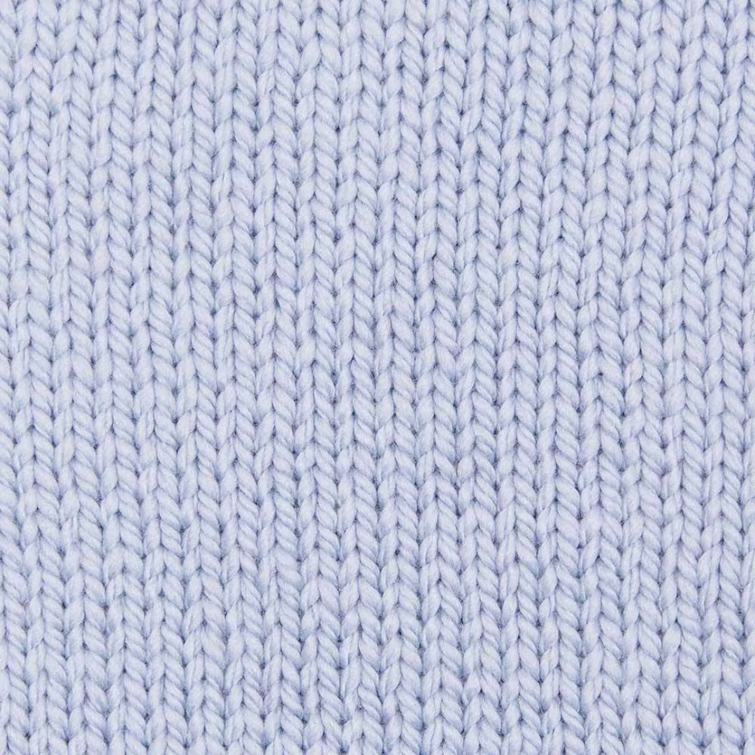 A knit swatch of a light blue yarn.