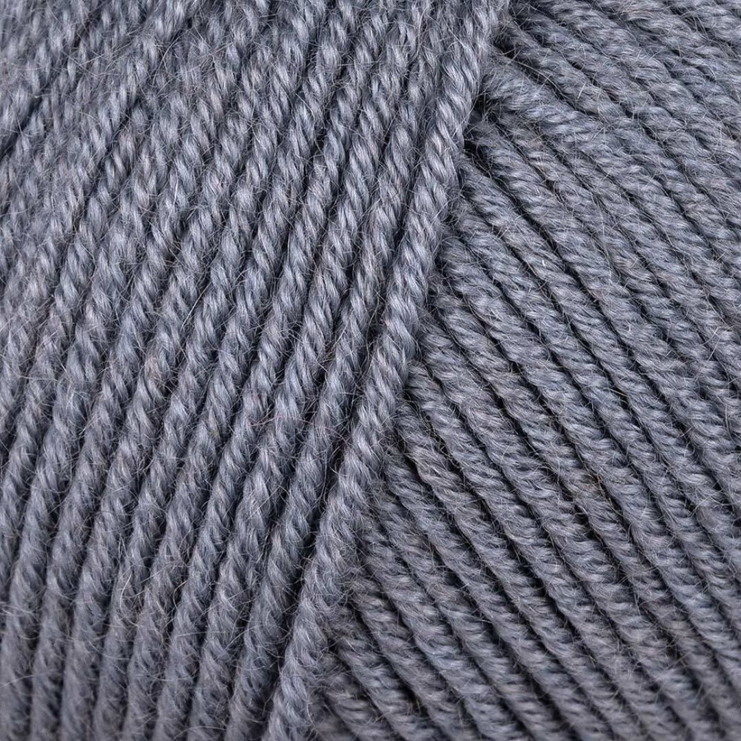 A close-up of a grey skein of Debbie Bliss Luna yarn.