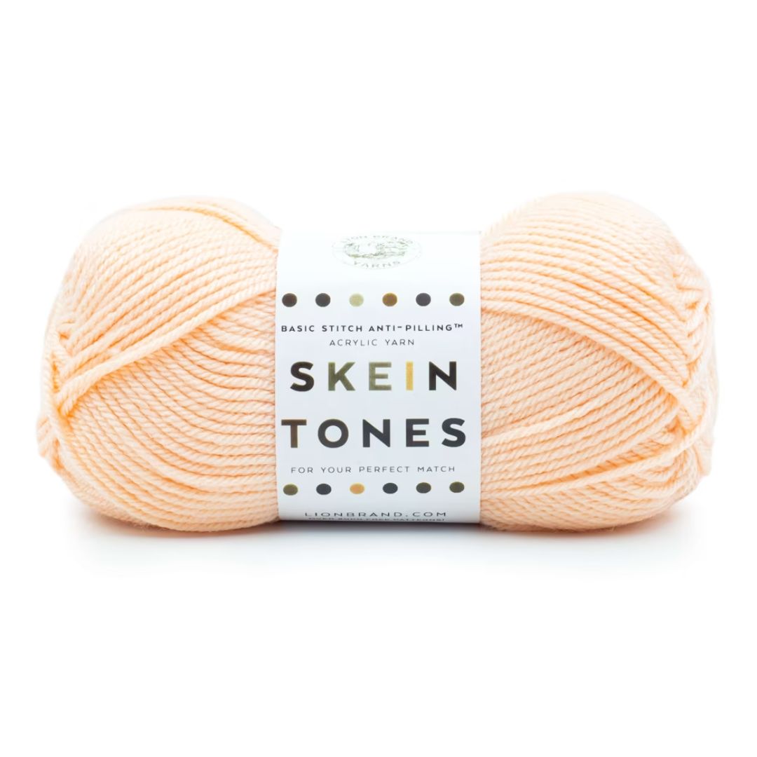 A light beige skein of yarn.