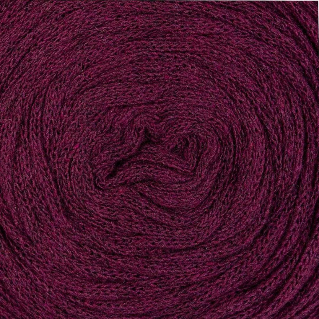 Close-up of maroon ribbon yarn made of recycled cotton.