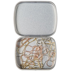 An open metal tin with locking stitch markers in silver, gold, and copper colors.