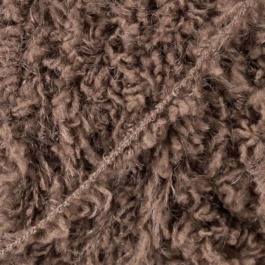 Close-up of brown fluffy yarn.