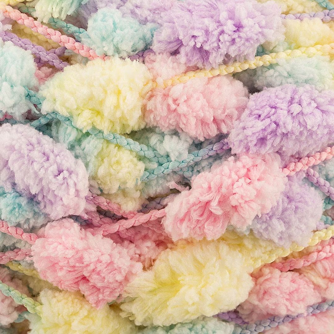 Close-up of multi-colored pastel pompom yarn.