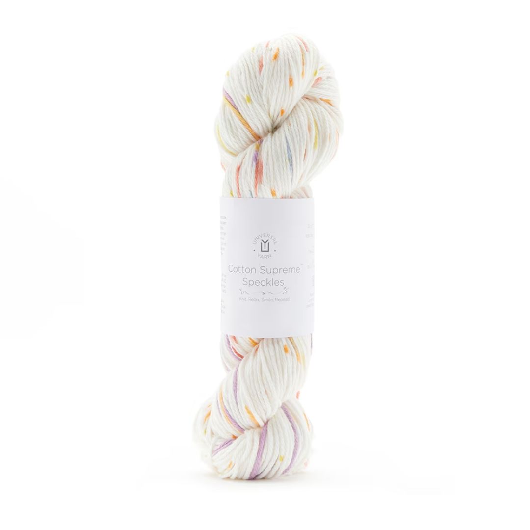 A hank of speckled white and peach Cotton Supreme yarn.