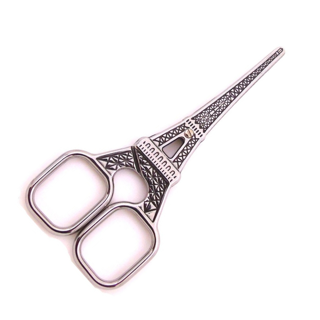 Small silver yarn scissors shaped like the Eiffel Tower.