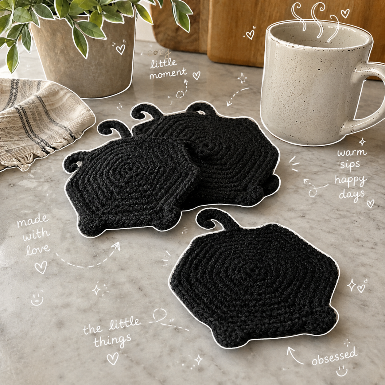 Black crochet Binx Bum Coasters styled beside a mug with playful doodle notes