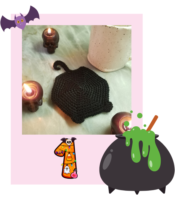Daily Haunted Yarn Ball polaroid featuring a black crochet coaster with spooky decorations.